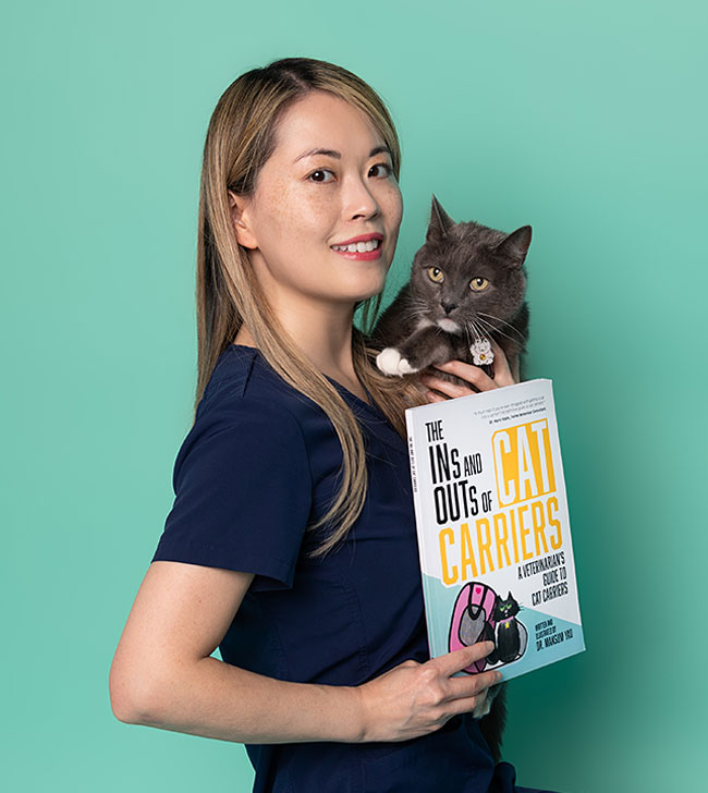 AHELP Project Guest Blogger - Dr. Mansum Yau holding Boo, the cat, and her cat carrier book