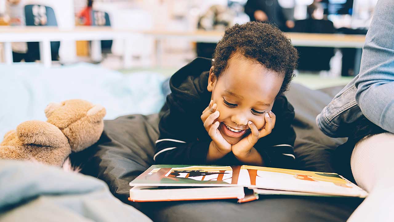 AHELP Project - Child reading a picture book that helps them cope with loss and grief