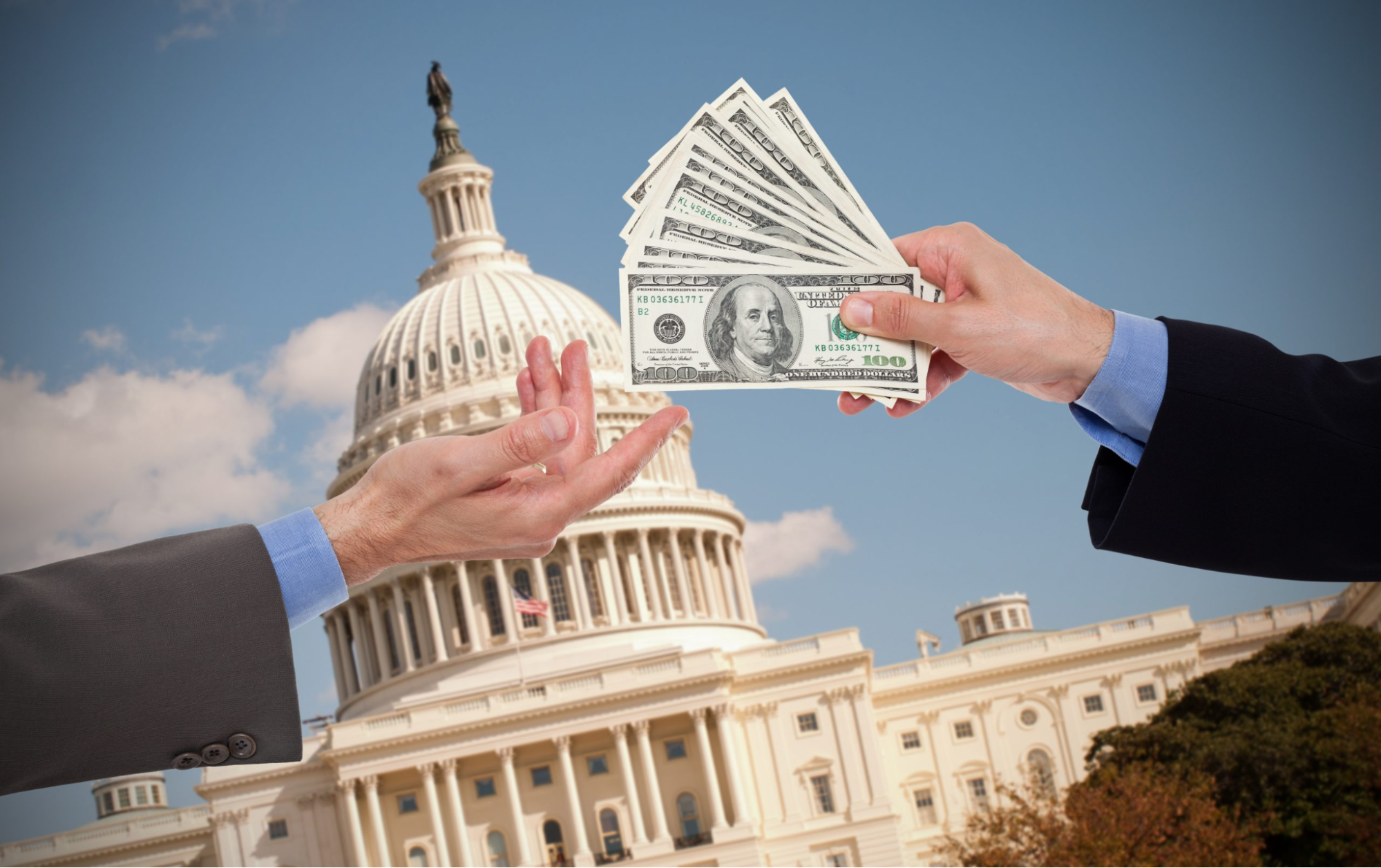 Money changing hands in front of the US Capitol