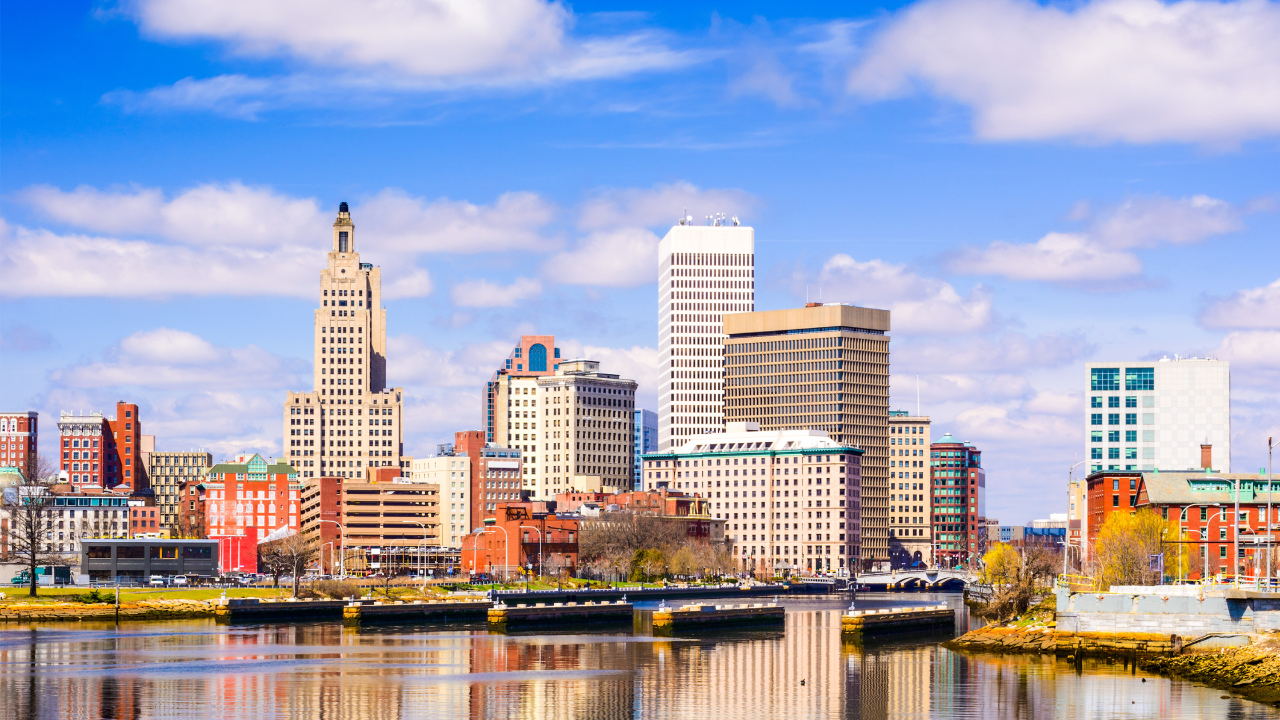 Providence, Rhode Island city skyline and waterfront during a sunny day.