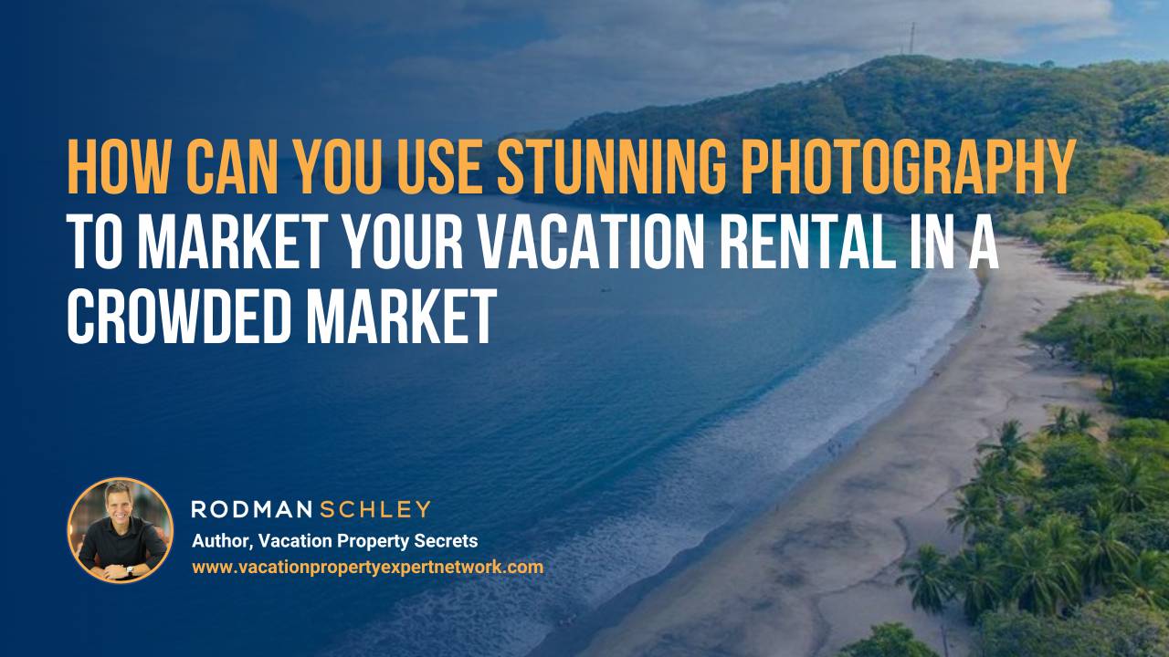 Aerial view of a coastline with a sandy beach and lush green trees on the right. Text overlay reads: 'How can you use stunning photography to market your vacation rental in a crowded market.' Below, a small circular photo of Rodman Schley with his name, title 'Author, Vacation Property Secrets,' and website 'www.vacationpropertyexpertnetwork.com'.