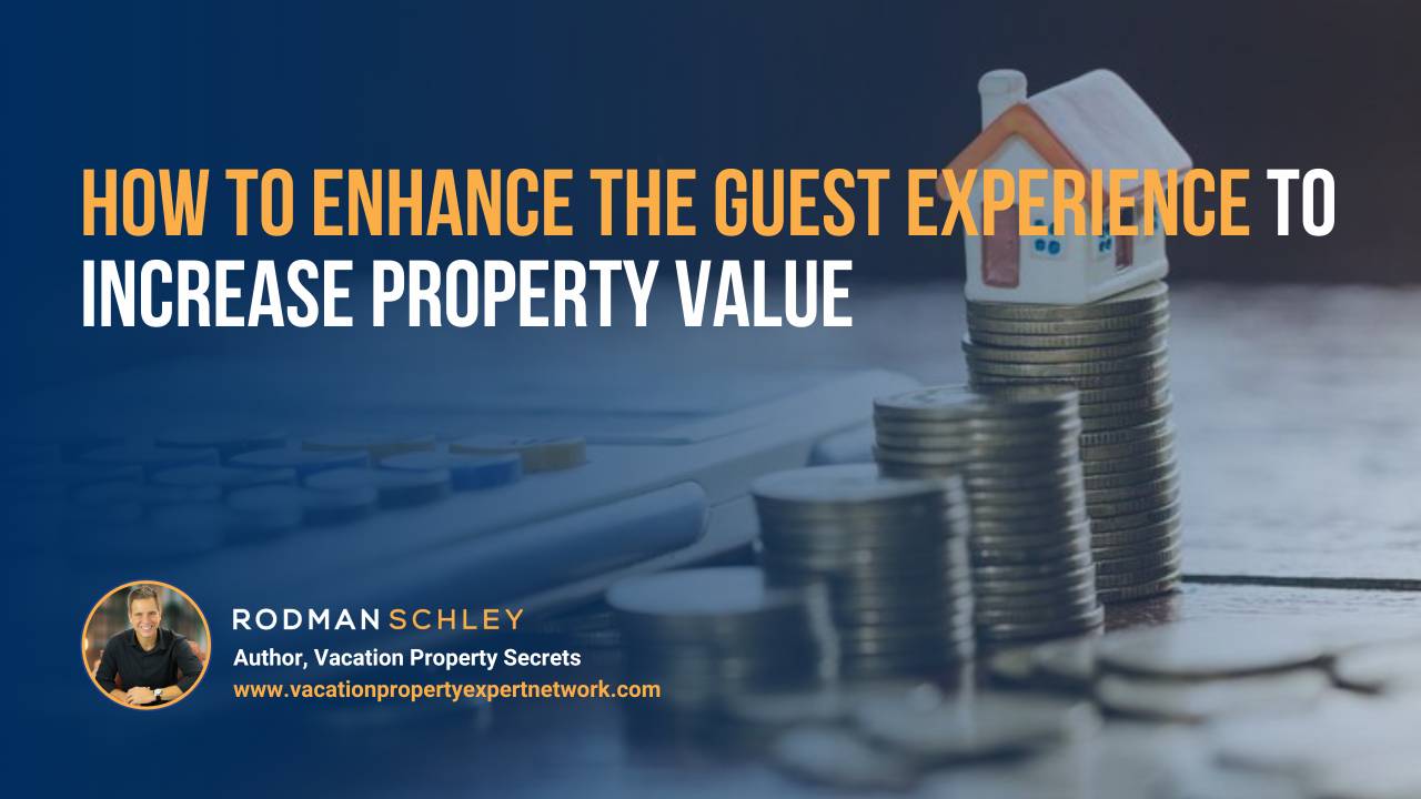 Image of stacked coins with a small house model on top and a calculator in the blurred background. Text overlay reads "How to Enhance the Guest Experience to Increase Property Value" with a small portrait of Rodman Schley, Author of "Vacation Property Secrets," and the website www.vacationpropertyexpertnetwork.com.