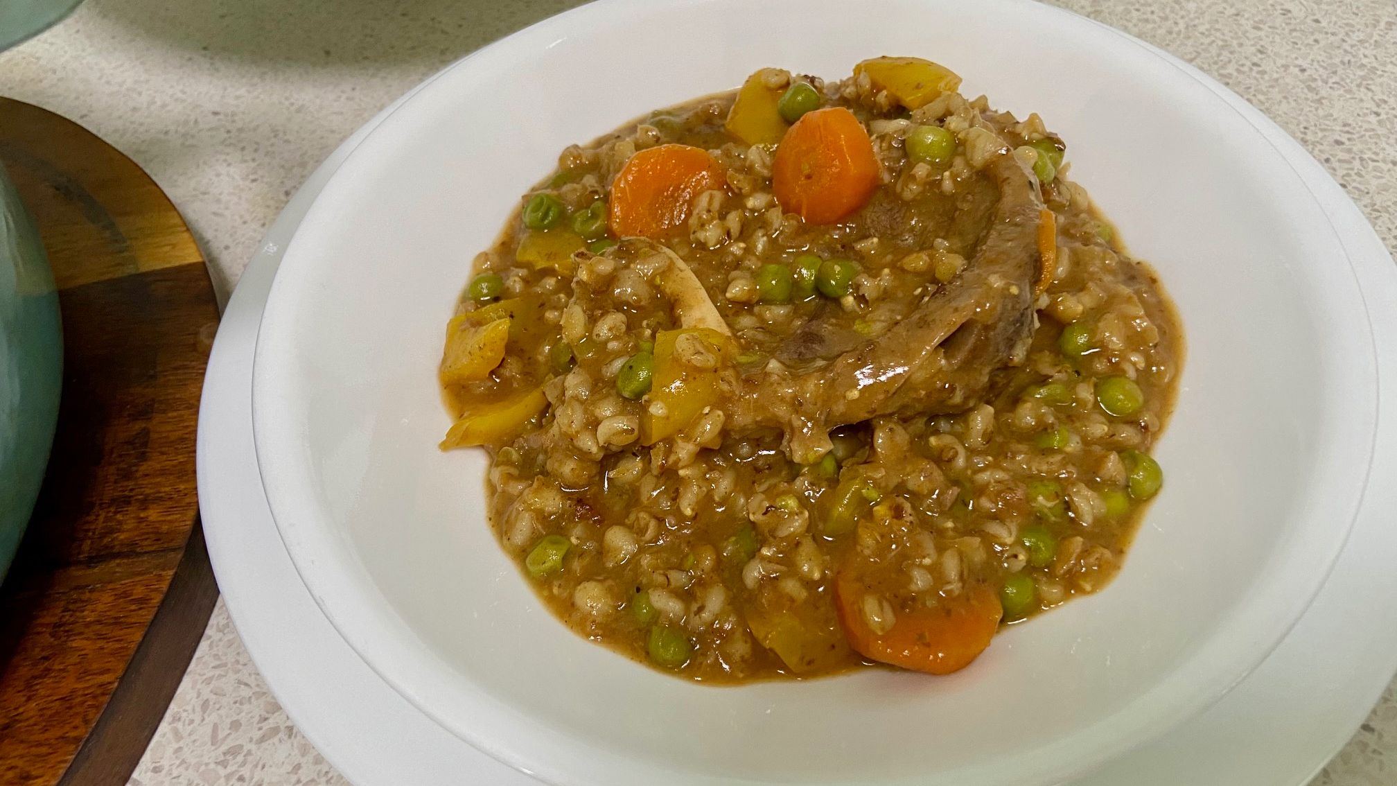 Osso Bucco and Barley served on a white dis