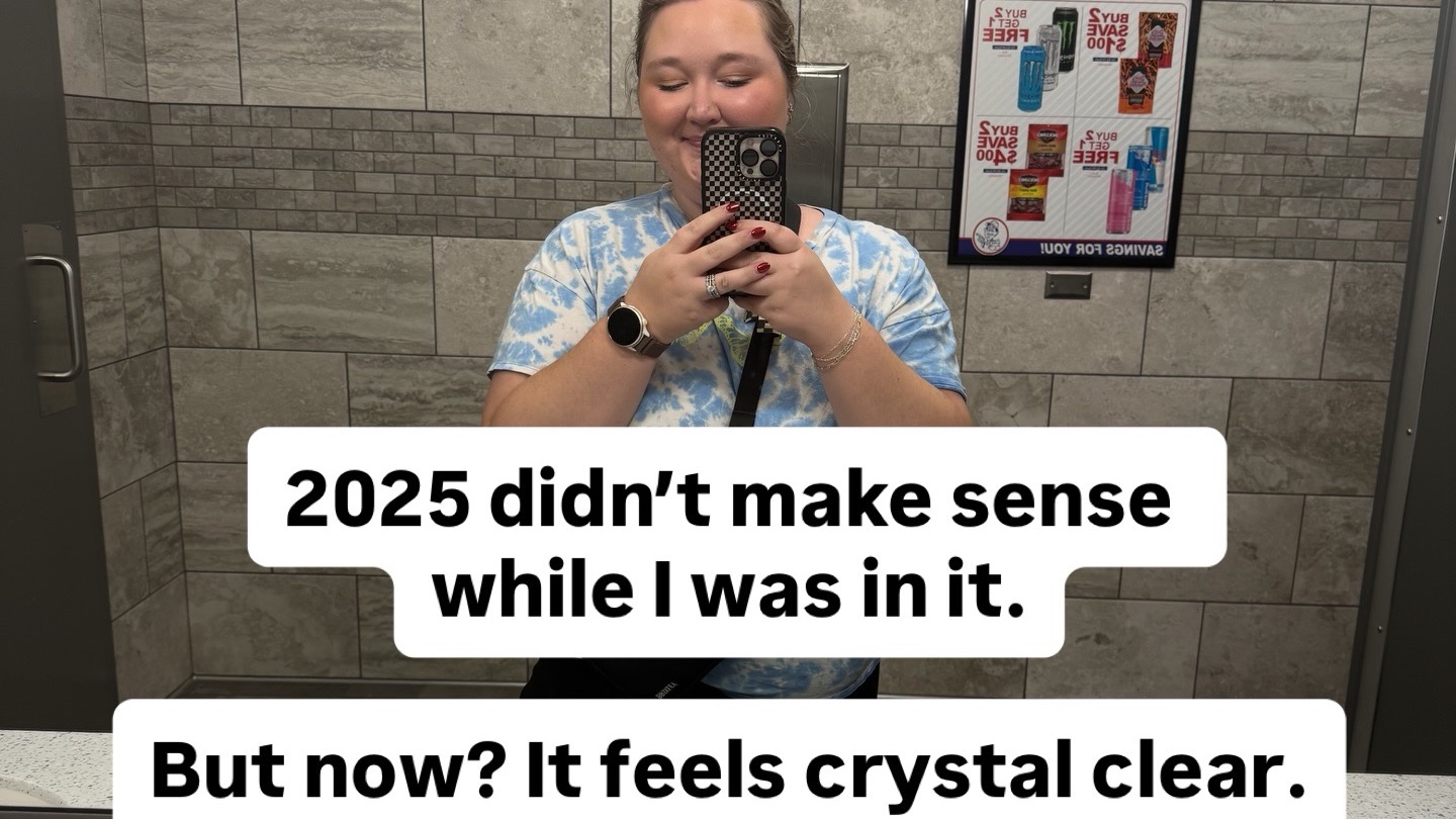Mirror selfie of a woman in a tiled restroom holding a phone. Overlaid text reads: “2025 didn’t make sense while I was in it. But now? It feels crystal clear.” Subtext says: “Read this if 2025 felt weird, heavy, or in-between for you too.” The image supports a reflective post about growth, recalibration, and building clarity for 2026.