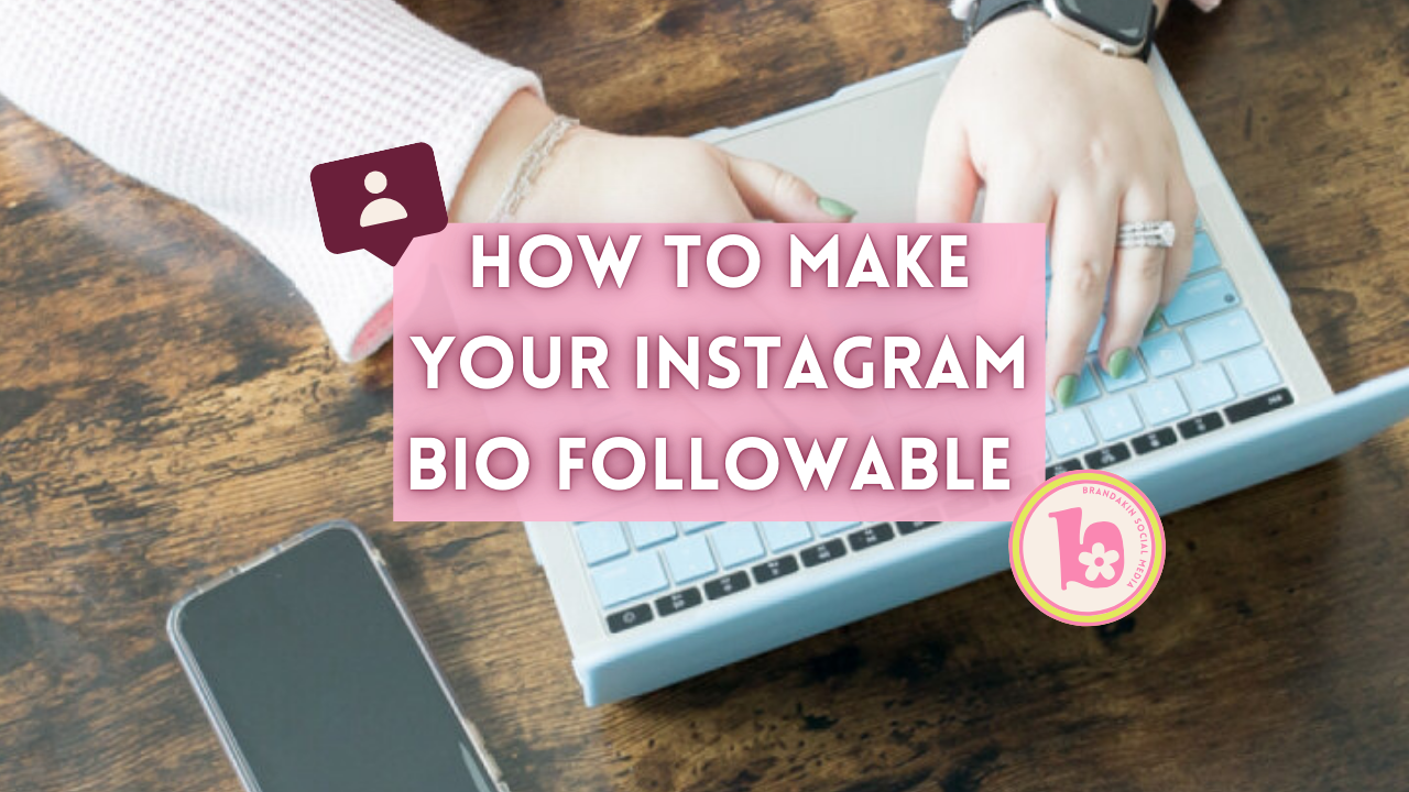 Overhead photo of hands typing on a pastel blue keyboard with a phone nearby on a wooden table. Text overlay reads “How to Make Your Instagram Bio Followable” in bold white letters on a pink background. Includes a Brandakin Social Media logo and profile icon graphic.