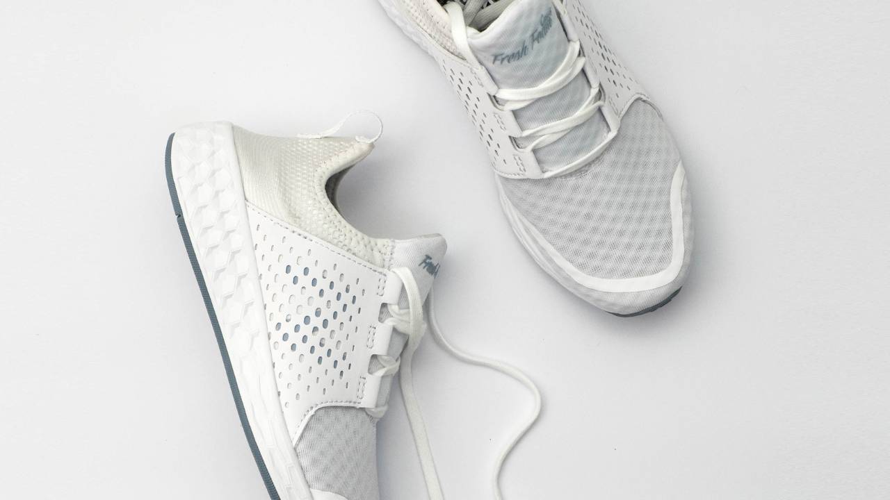 a pair of white running shoes representing the start or restart of a running habit in January