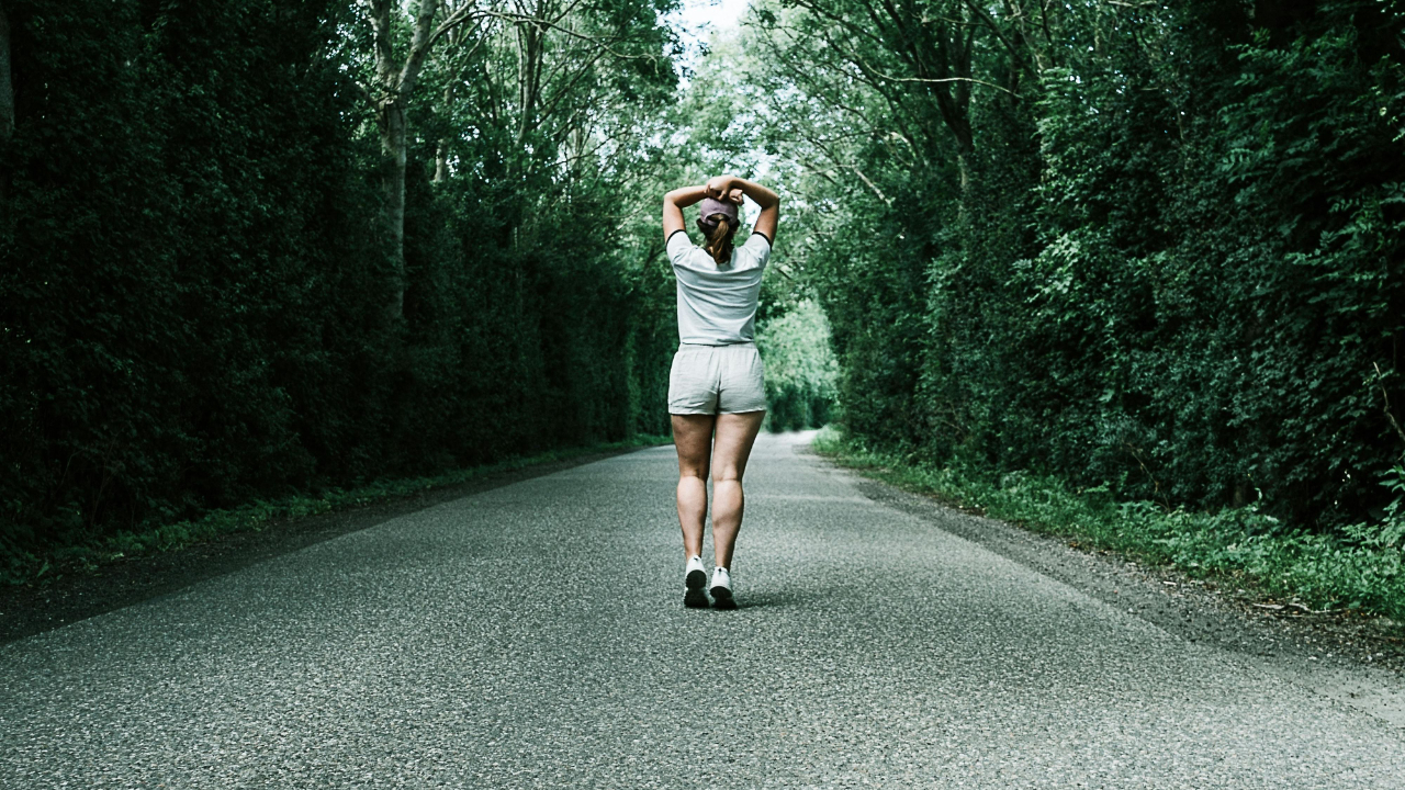 outdoor runner completing a run and building a running consistently habit