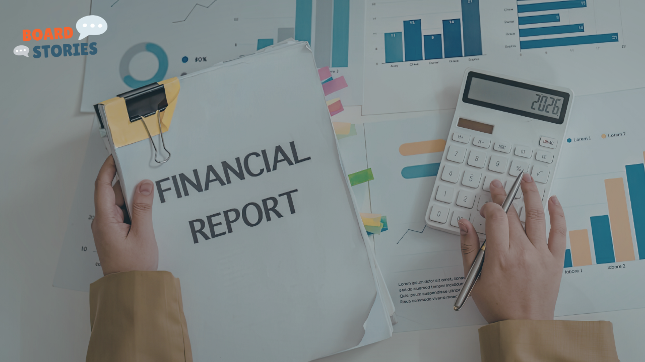 An image of hands holding a financial report and a calculator, against a backdrop of financial charts on a table.