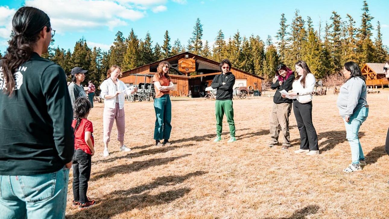 Naqsmist team members standing in circle