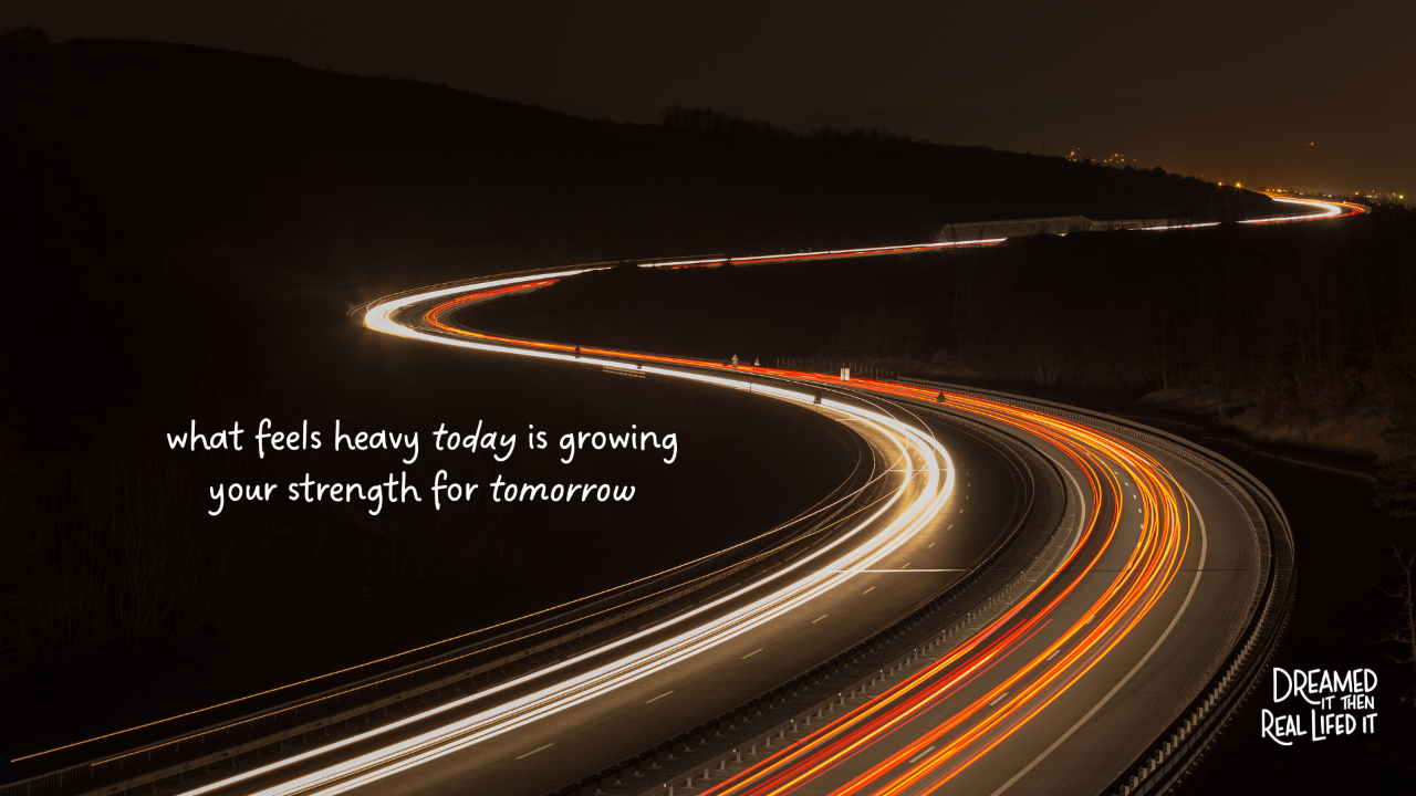 Dreamed It then Real Lifed It podcast image of black night with curving road and motion blur of headlights driving fast with words "what feels heavy today is growing your strength for tomorrow"