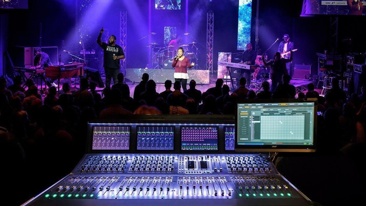 Modern church worship service with band on stage, clear lyrics on LED screen, balanced lighting, and engaged congregation singing.