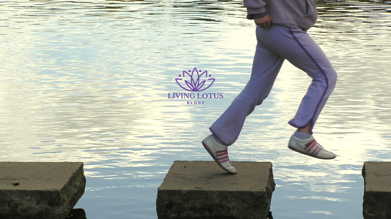 person running on rocks over water