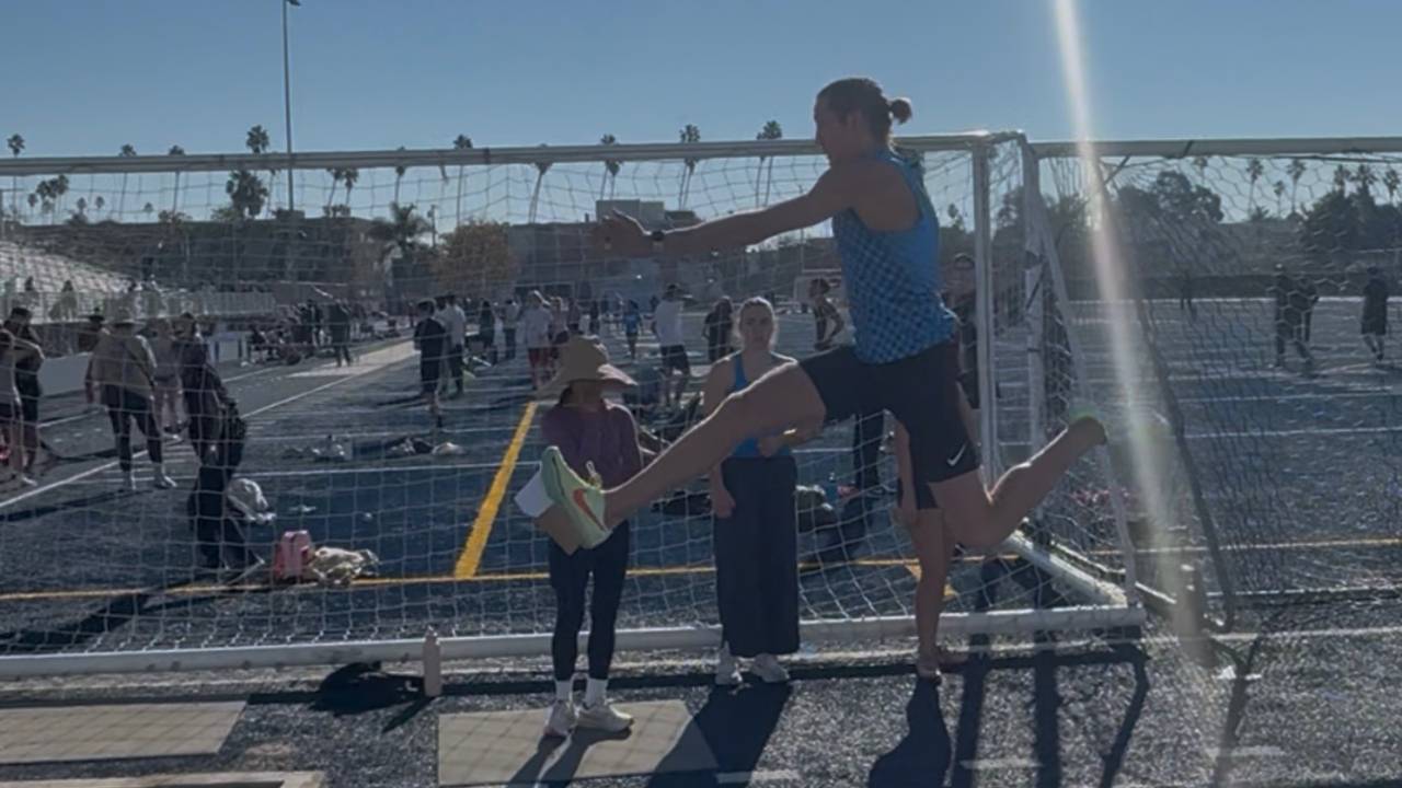 Master athlete jumping in a long jump competition, representing Kevin Staniszewski’s 19'6 six step performance.