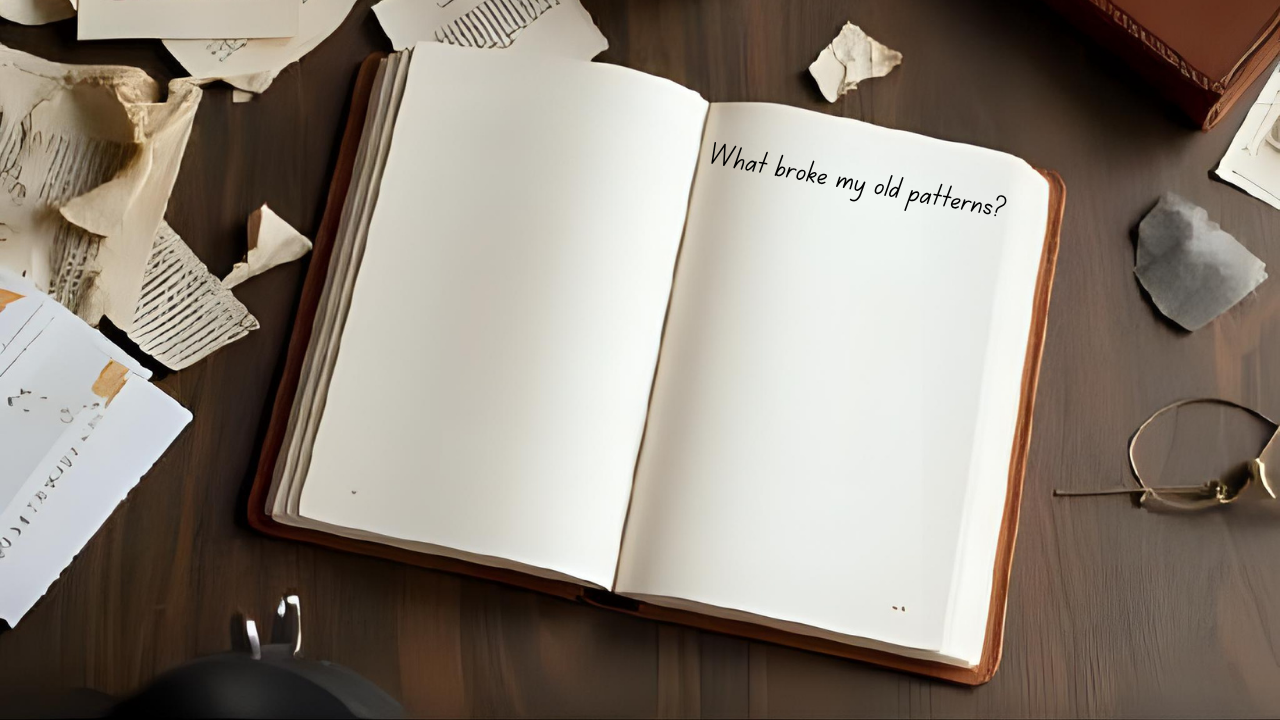 Open leather journal with handwritten question 'What broke my old patterns?' surrounded by crumpled papers, illustrating leadership harvest assessment and reflection process