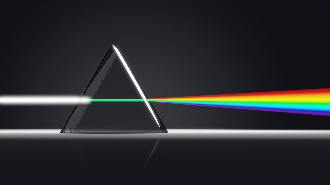 Prism refracting light into a spectrum representing clarity emerging from complex leadership decisions