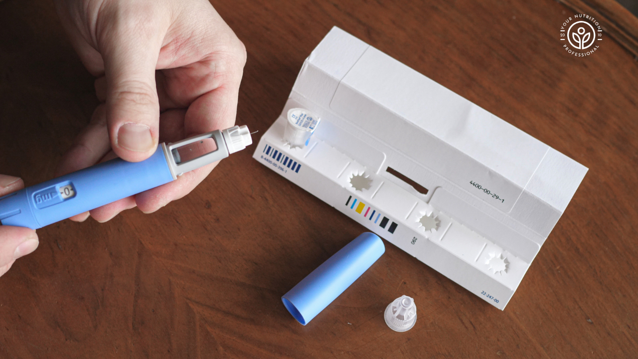 Weight loss injection pen on a table next to its packaging, commonly used for medications like Wegovy, Ozempic, and Mounjaro.