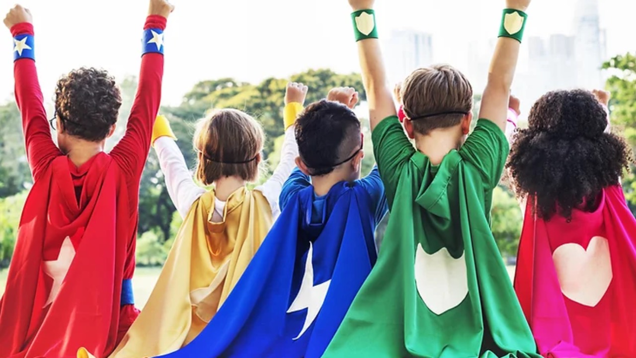 Kids wearing superhero capes