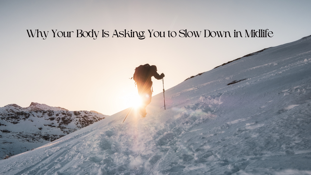 woman climbing up ski slope