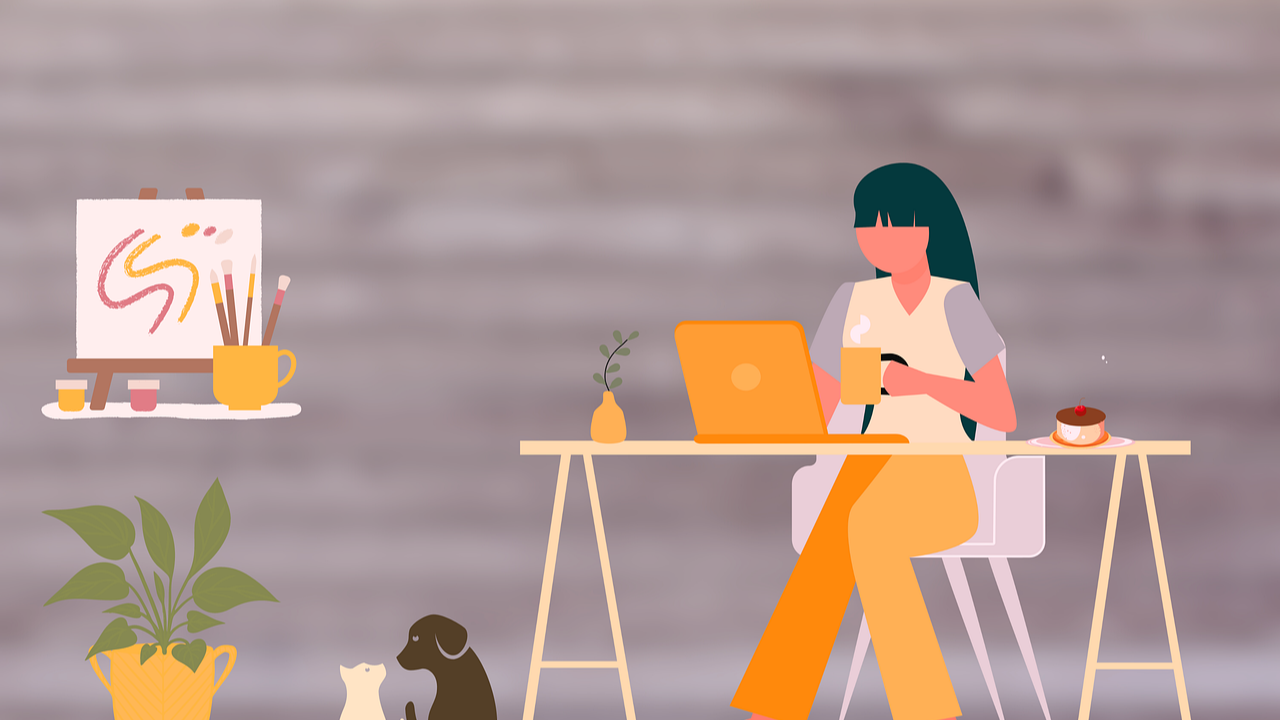 woman working at desk with artwork to the side