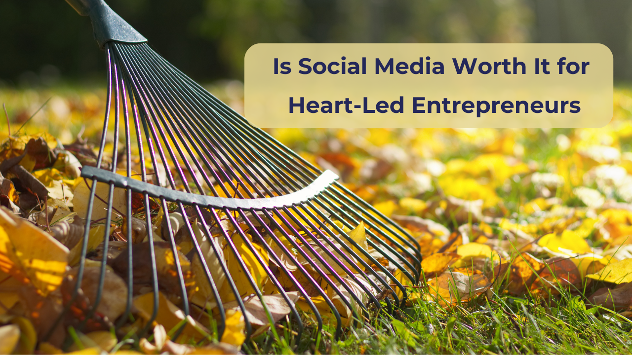 A close-up image of a rake resting on colourful autumn leaves in a garden, symbolising gentle tending and seasonal reflection for heart-led entrepreneurs.