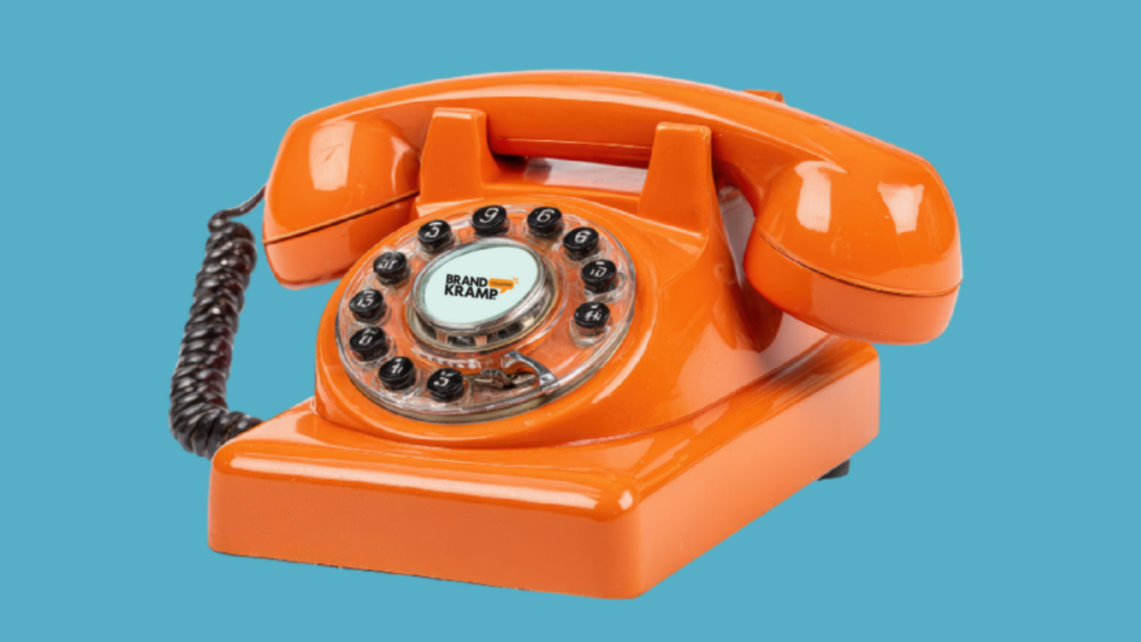 image of an orange dial phone
