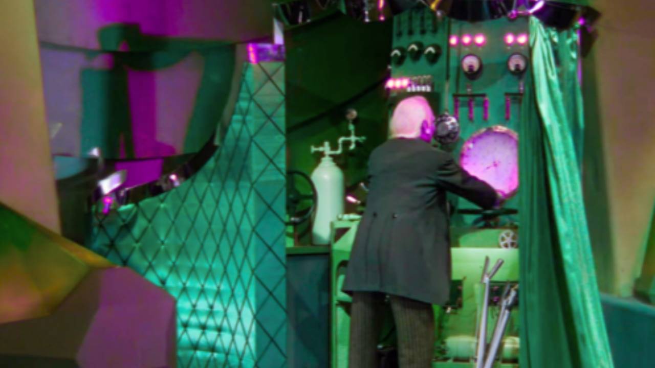 The Wizard Of OZ behind the curtain pulling levers