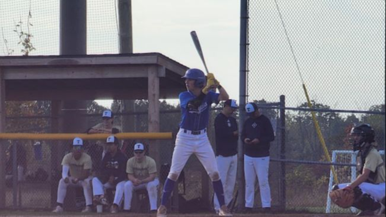 Chris Errington taking a swing, symbolizing courage, risk, and taking action toward freedom and purpose.