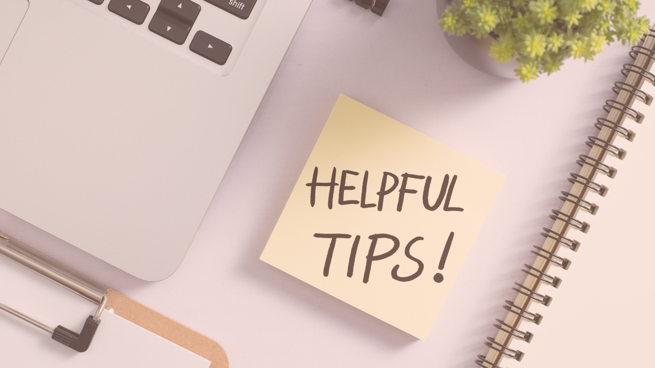 A desk setting with a post-it note that reads "Helpful Tips!"