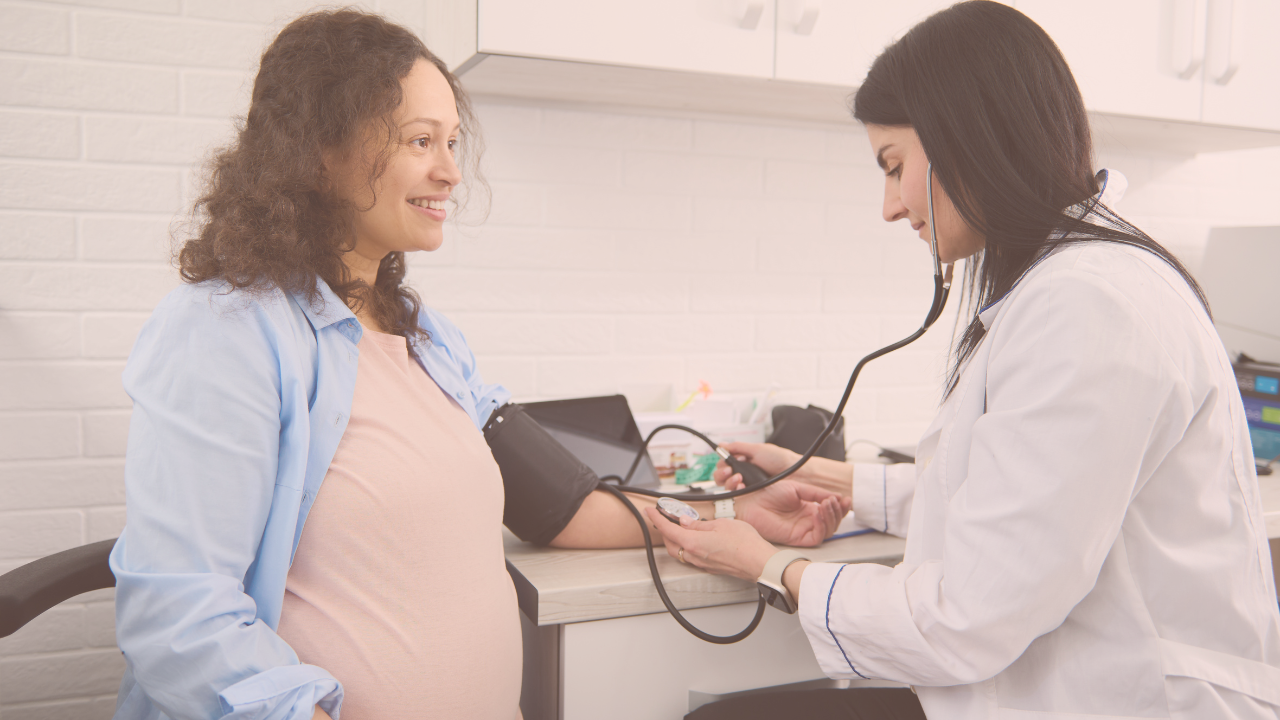 pregnant woman getting a checkup at the doctor