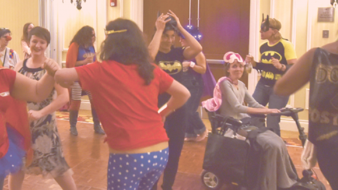 doulas wearing superhero costumes