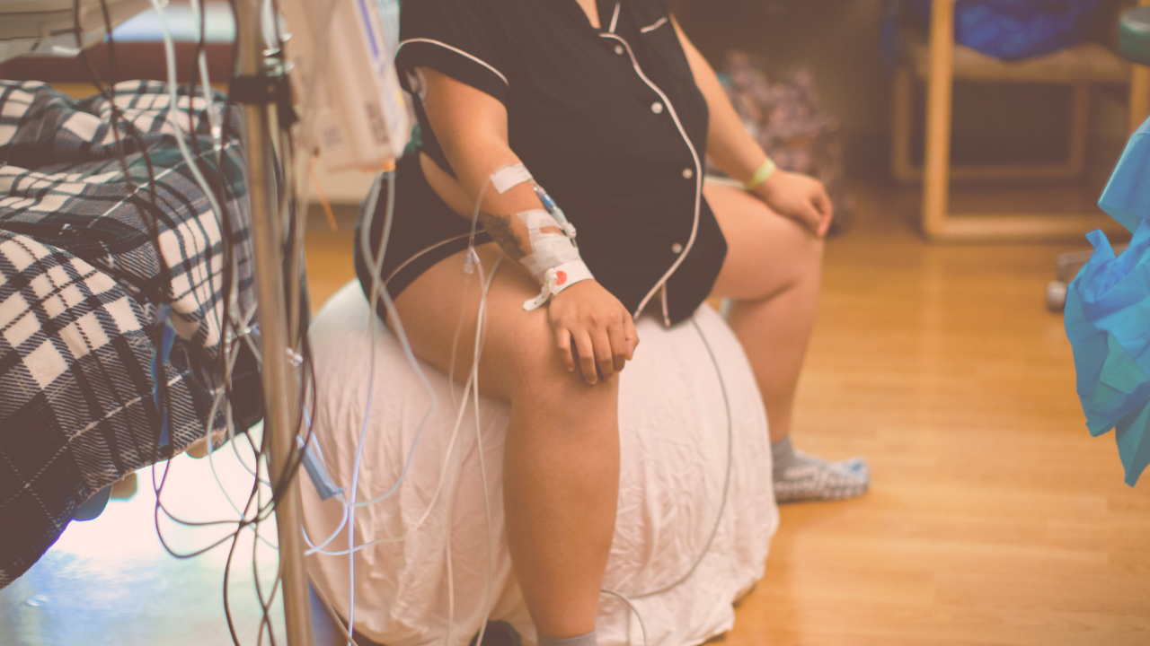 a pregnant woman in labor sitting on a exercise ball