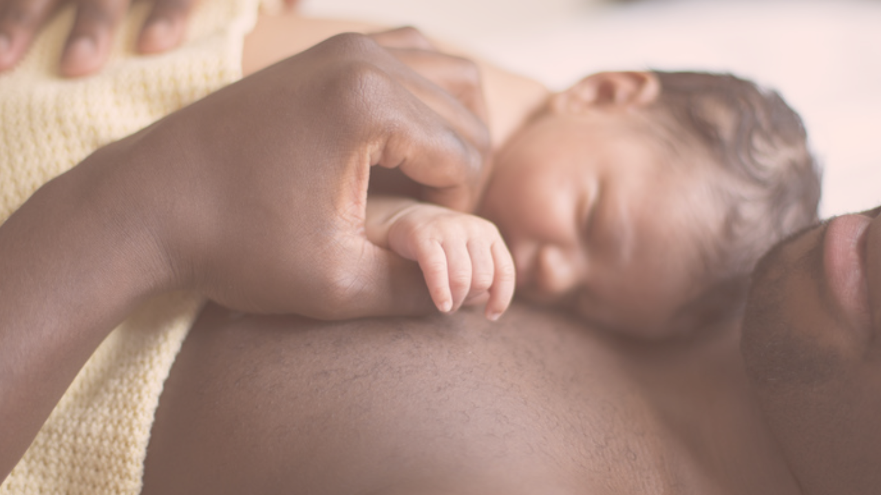 dad holding a baby on his chest