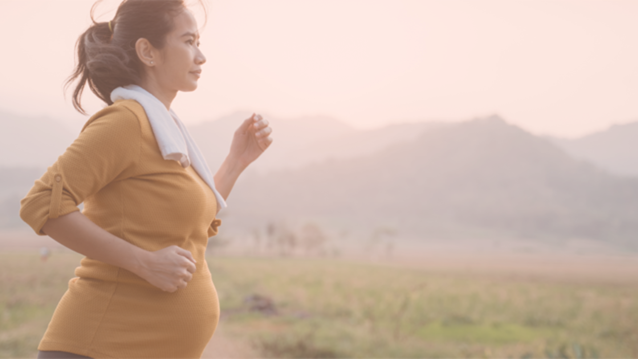 A woman running while pregnant