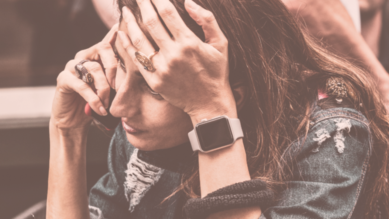 A woman having a stressful phone call