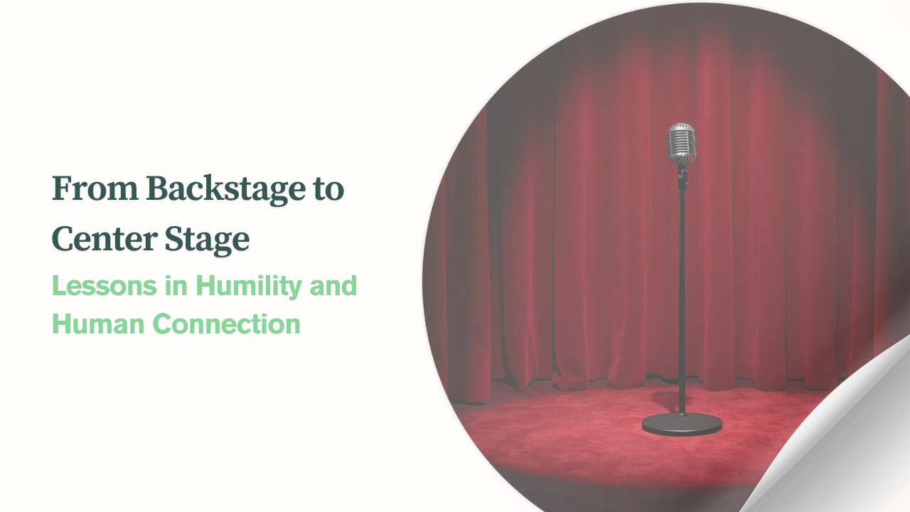 Center-stage microphone in front of red curtains symbolizing humility and human connection in grant writing.