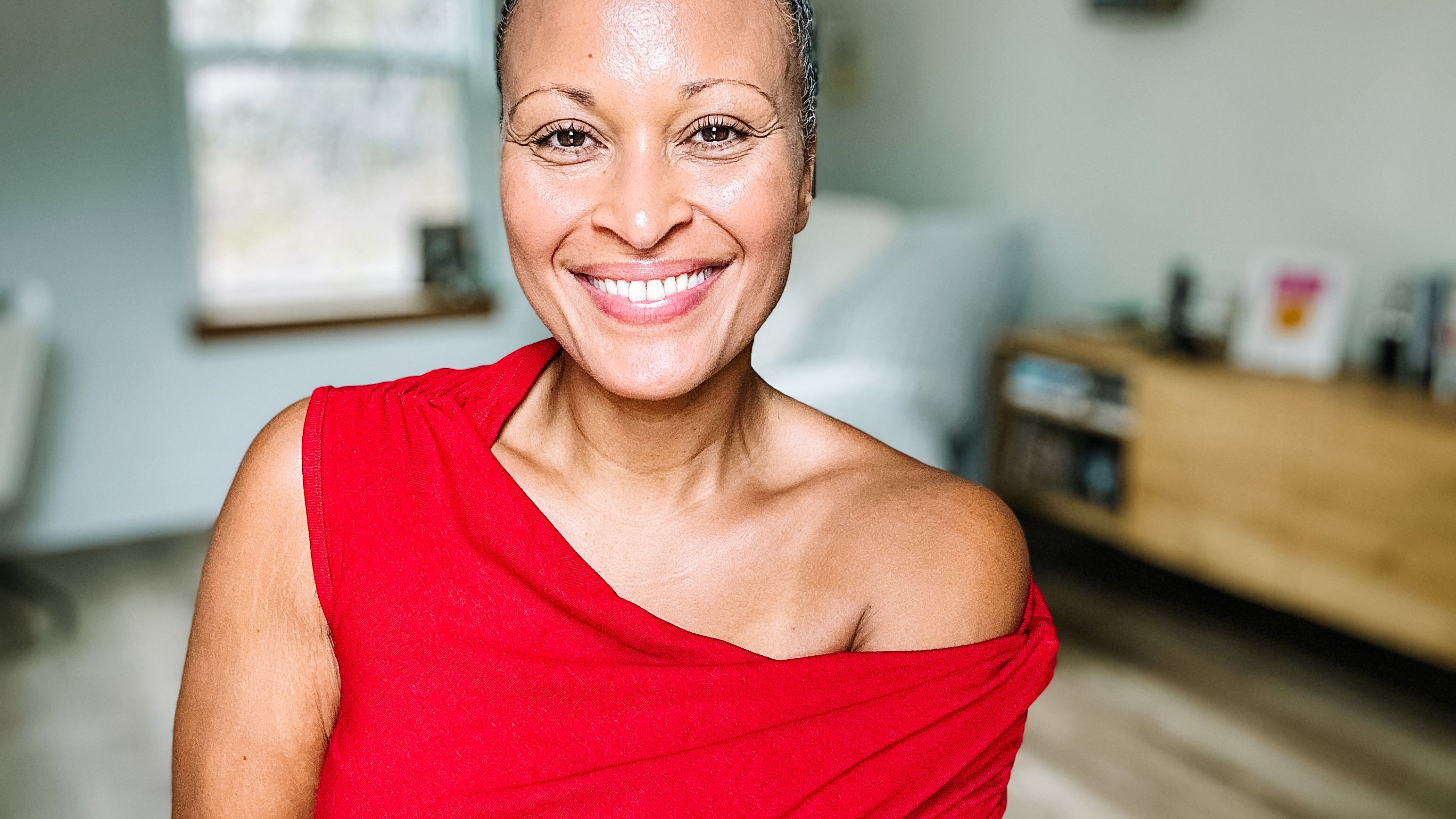 Woman in red off-shoulder top