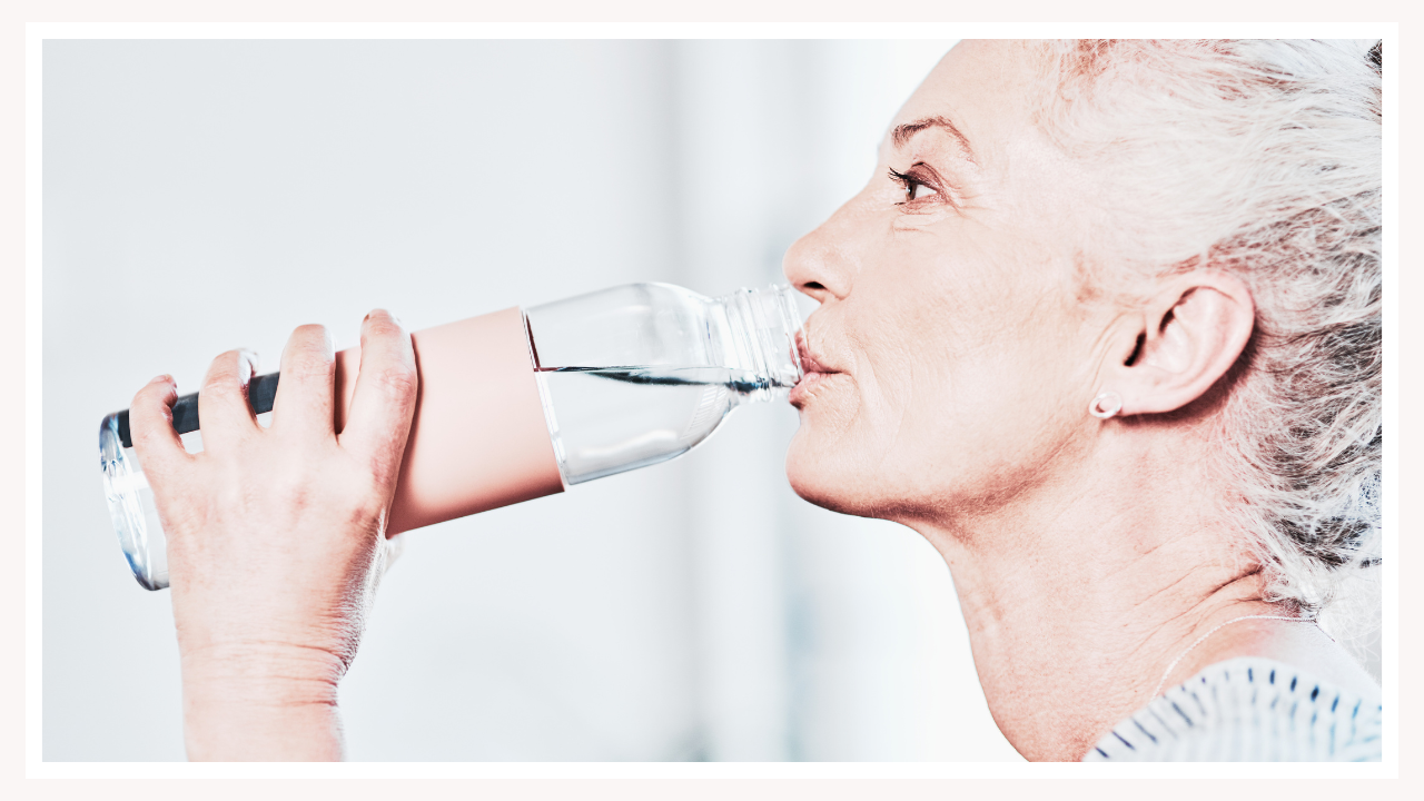 woman drinking water with electrolytes