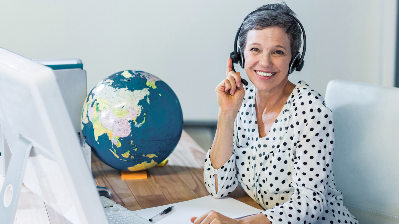 Travel agent in front of a computer