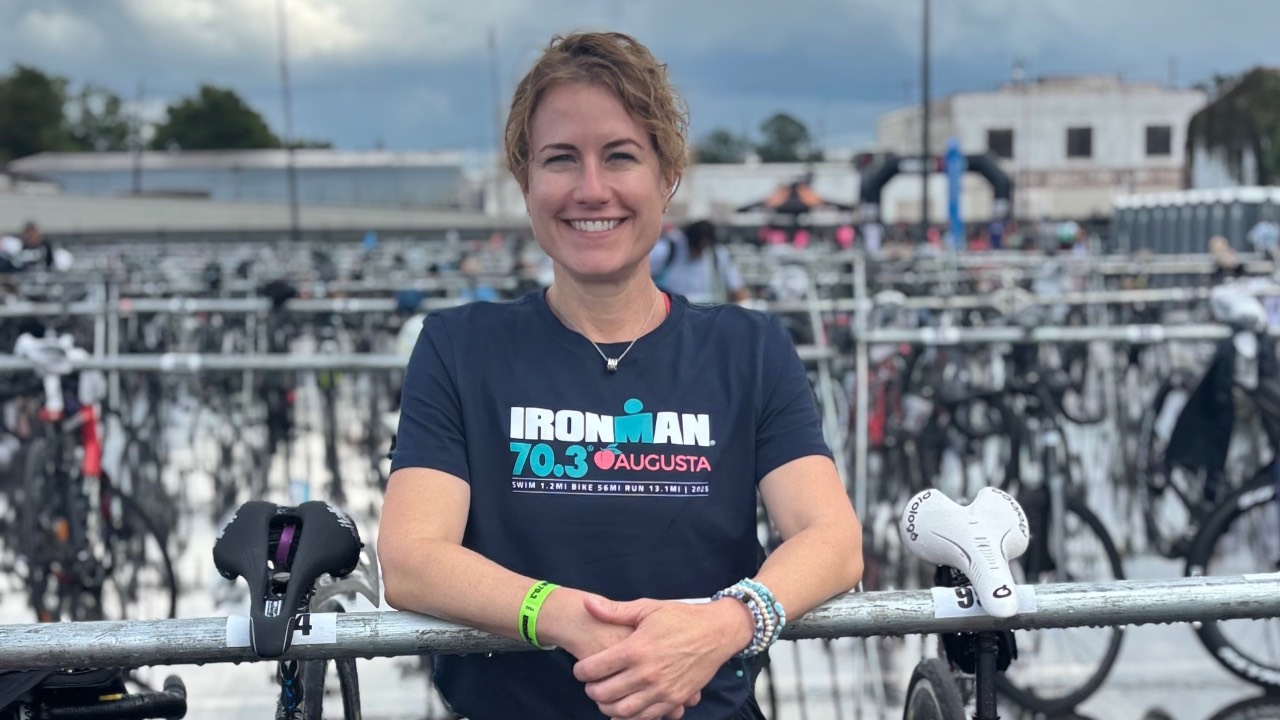 Author surrounded by bikes in Ironman Augusta transition area