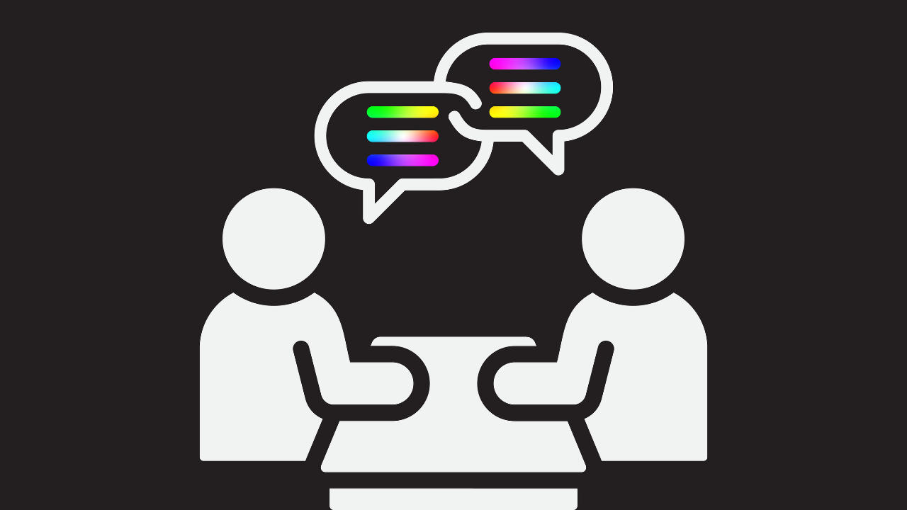 Two icons of people sitting opposite each other at a table, with speech bubbles above them with spectrum coloured lines to represent a conversation