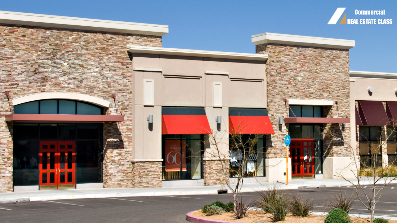 Strip shopping center with multiple retail storefronts representing commercial real estate investing in income-producing retail properties.