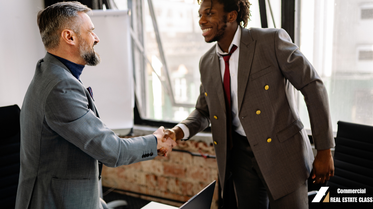 Commercial real estate investors shaking hands on a property deal representing on-market and off-market commercial investment opportunities.