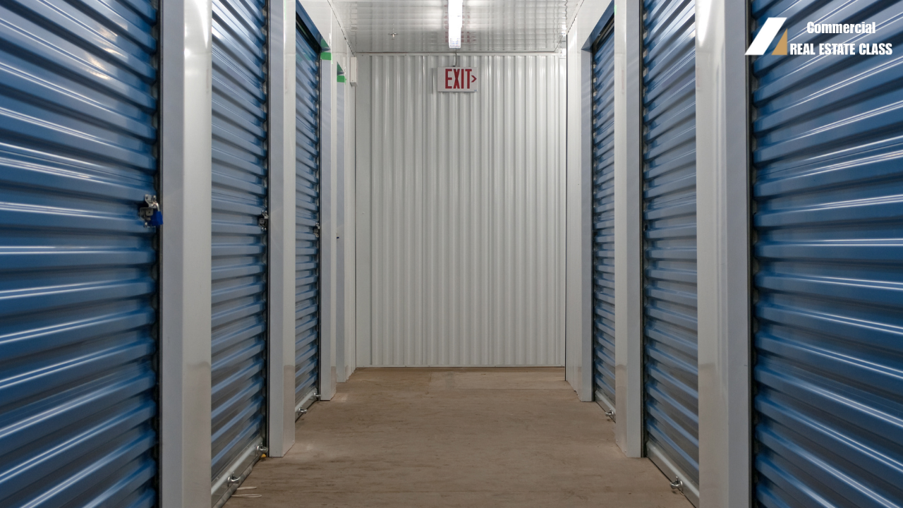 Large self-storage facility with rows of rental units representing commercial real estate investments that generate income from monthly storage rentals.