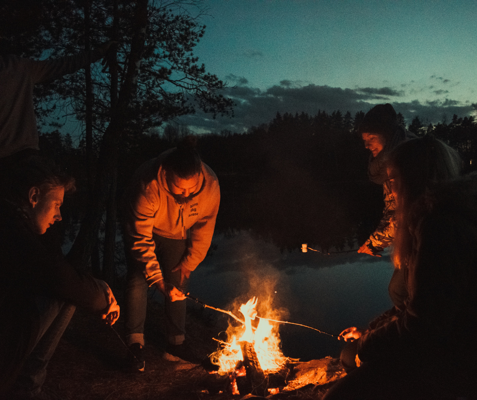 Friends enjoying bonfire together