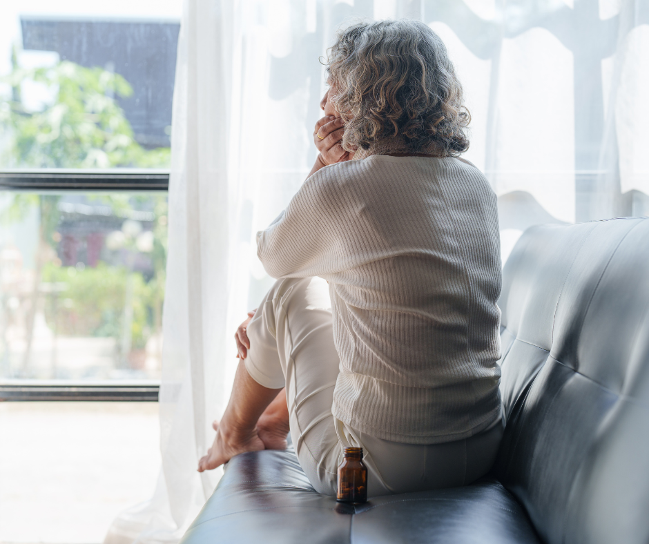 Woman sitting alone representing loneliness