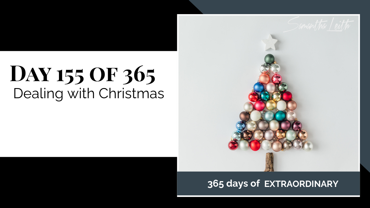 A flat-lay image of a holiday design featuring a Christmas tree made of assorted matte and glossy ornaments, with a wooden trunk and a white star, used to illustrate a blog post on managing the challenges of the Christmas season.