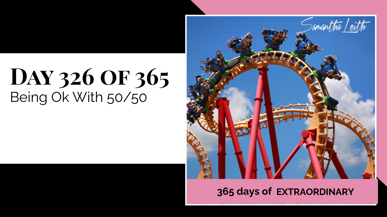 Day 326: Samantha Leith 365 Days of Extraordinary, Day 326: Being Ok With 50/50. Image of a tall yellow and red roller coaster track looping into a bright blue sky with white clouds.