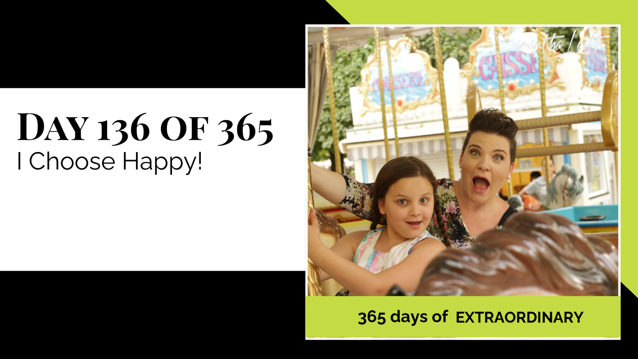 Blog image for Day 136 of Sam Leith's '365 Days of Extraordinary' series, showing the author Samantha Leith and a young girl riding a classic carousel or fairground ride, both looking excited and joyful, symbolizing choosing happiness and fun.