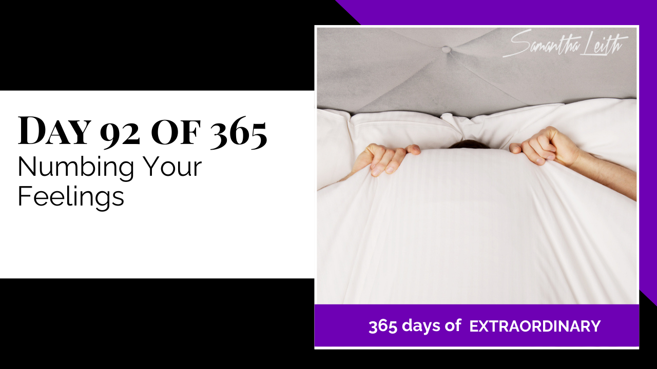 Blog thumbnail showing a person hiding completely under a large white duvet or comforter with only their hands gripping the edge, symbolizing emotional avoidance, anxiety, and the act of numbing feelings.