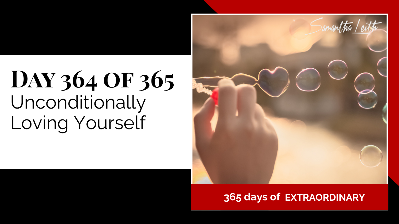 Day 364: Samantha Leith 365 Days of Extraordinary, Day 364: Unconditionally Loving Yourself. A close-up of a hand blowing bubbles, with one bubble in the foreground shaped like a heart against a sunset background.